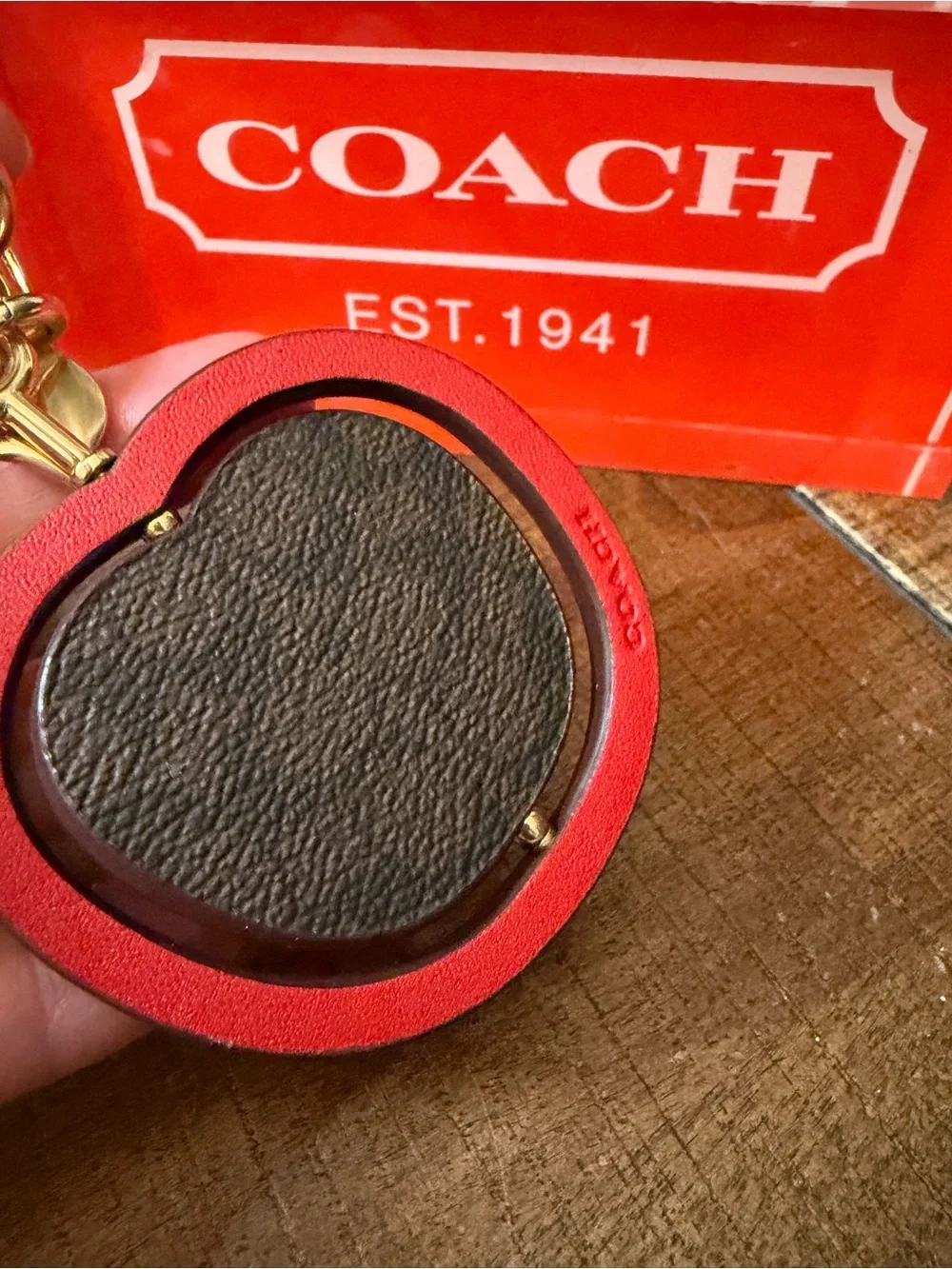 Coach Swivel Apple Charm